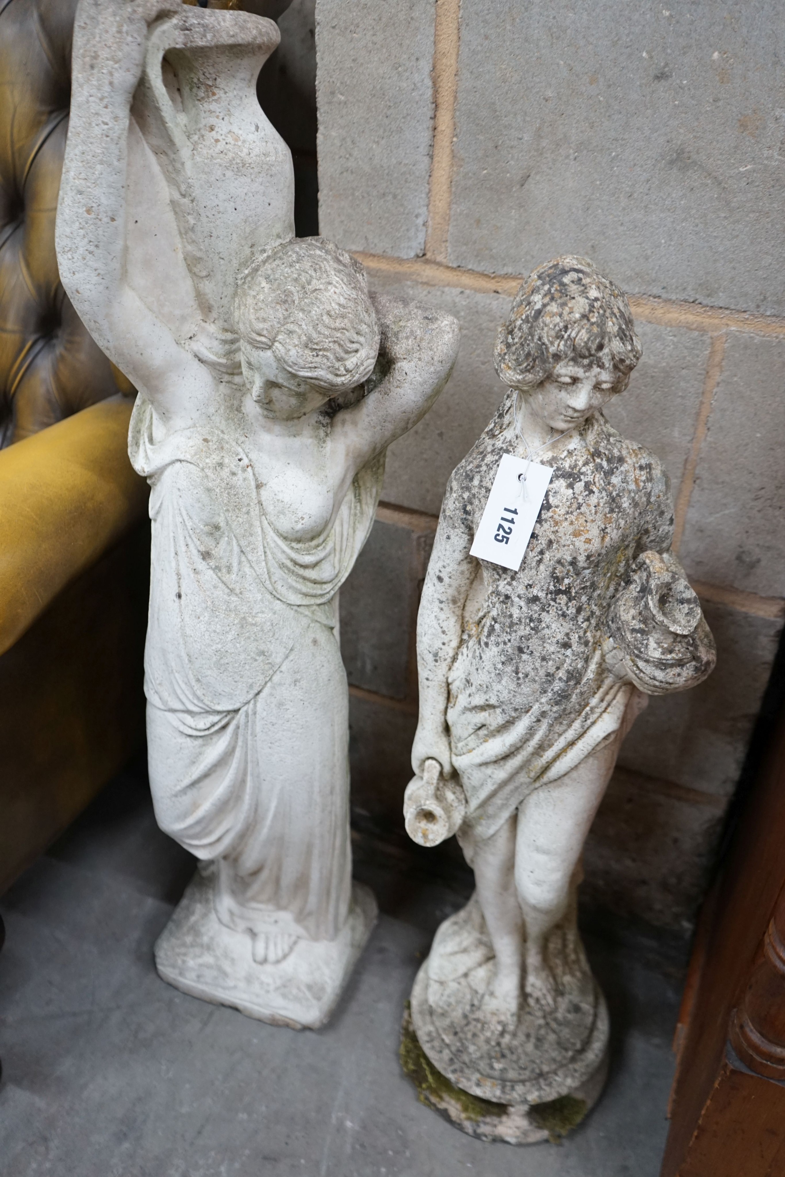 Two reconstituted stone figural garden ornaments, larger height 88cm